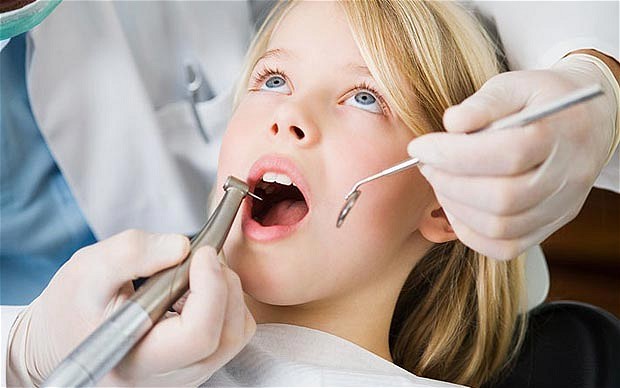 NHS dentists in England carried out almost 850,000 fluoride varnish treatments on young people in 2010-11 Photo: ALAMY